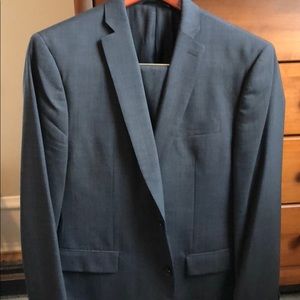 Men’s gray suit jacket and flat front pant